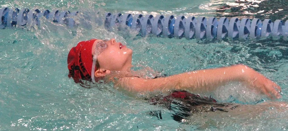 The fluid essential to all life has a beauty of its own. It also helps support the weight of this swimmer.